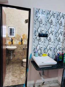 a bathroom with a sink and a shower at 1BHK Holiday Home in Nagpur