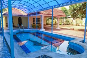 a house with a swimming pool at Panaiyur Guest house in Chennai