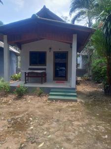 a small house with a bench in front of it at Maleeya garden guest house in Ko Chang