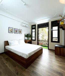 a bedroom with a large bed in a room at Hanoi Oriental Viewl Hotel in Hanoi