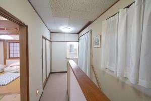 Postel nebo postele na pokoji v ubytování 板東ビル