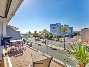a balcony with a view of a city street at Sea La Vie + Inverter+Parking in Cape Town