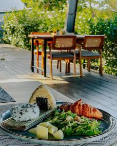 a plate of food with meat and vegetables on a table at 墾丁圓石灘 Kenting Pebble Beach in Fangshan