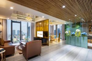 a lobby with a view of a building at Winsuites Saigon - Luxury Boutique Hotel in Ho Chi Minh City