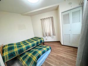 Postel nebo postele na pokoji v ubytování MATUBARA HOUSE