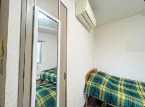 Postel nebo postele na pokoji v ubytování MATUBARA HOUSE