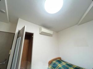 Postel nebo postele na pokoji v ubytování MATUBARA HOUSE