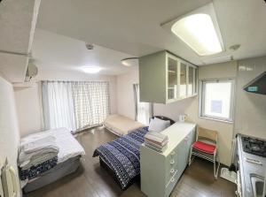 Postel nebo postele na pokoji v ubytování MATUBARA HOUSE