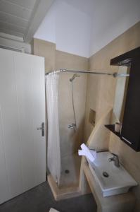 Koupelna v ubytování Domus Arch Residences