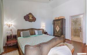 a bedroom with a bed and a walk in shower at Bella Vista in Barat +42 photos