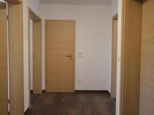 an empty hallway with a door and wooden floors at Dreamy Holiday Home in Ellscheid with Terrace in Ellscheid