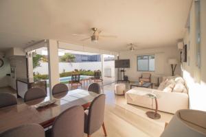 a living room with a couch and a table at Pacific Shores Retreat & Getaway in Nuevo Vallarta 