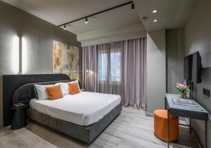 Postel nebo postele na pokoji v ubytování Arcadion Hotel
