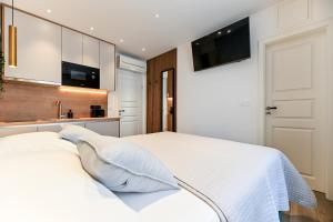 Posteľ alebo postele v izbe v ubytovaní Apartments and Rooms Nekic