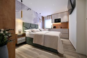 Posteľ alebo postele v izbe v ubytovaní Apartments and Rooms Nekic