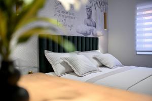 Posteľ alebo postele v izbe v ubytovaní Apartments and Rooms Nekic