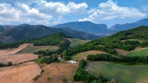 an aerial view of a valley with mountains at Agriturismo Il Fienile di Cà Battista in Cagli