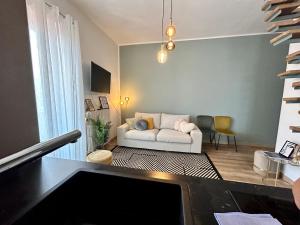 a living room with a couch and a table at Design Home at garda Lake in Desenzano del Garda