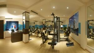 a gym with cardio equipment in a building at CAG Pride in Coimbatore