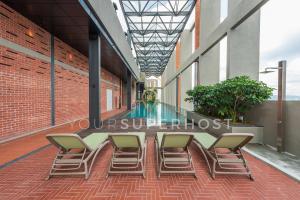 a long table and chairs in an empty building at Millerz Square Tower E Near MidValley by YourSuperhost in Kuala Lumpur