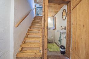 a staircase in a tiny house with a bathroom at Plan B Appartementen in Bad Kleinkirchheim +49 photos