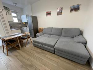 a living room with a couch and a table at Appartamento nel Borgo in Turin