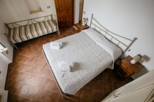 Postel nebo postele na pokoji v ubytování Ca' d'Alda