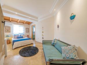 a bedroom with a bed and a couch at LaCitrus Villa Hotel in Kas