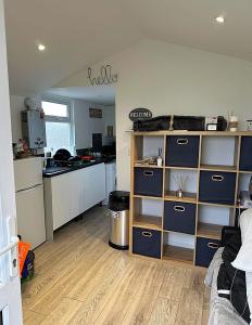 a kitchen with white cabinets and a counter top at Sheepy village Leysdown in Leysdown-on-Sea