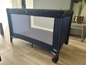 a black dolly with a bed in a room at Canyelles BBQ Apartment in Lloret de Mar
