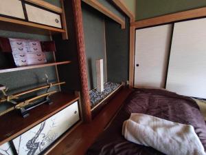 a small room with a bed and a window at One person Random room Local house stay- Vacation STAY 40532v in Hida