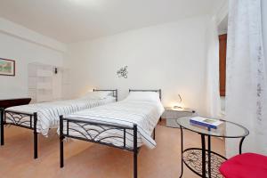 Voodi või voodid majutusasutuse Home and Garden Le Rondini toas