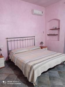 Postel nebo postele na pokoji v ubytování CASA DEL CASTAGNO NARBOLIA