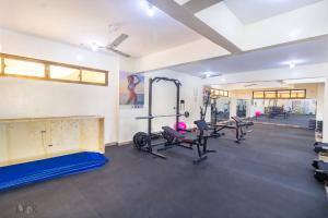 a fitness room with treadmills and tread machines at Mombasa Nyali Beachfront Apt in Mombasa
