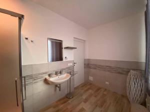 a bathroom with a sink and a mirror at Castello di Sabbia in Trabia +105 photos