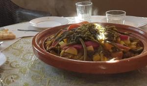 a bowl of food sitting on a table at Moschea di Agadir in Agadir