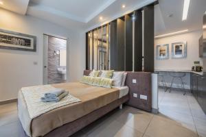 Voodi või voodid majutusasutuse Jules Suites toas