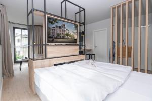 Ein Bett oder Betten in einem Zimmer der Unterkunft Komfort-Apartement 13