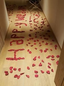 a bunch of red rose petals on a floor at Le Grand Chalet Zaarour in Zaarour