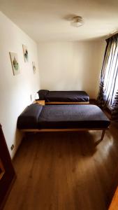 a bedroom with two beds in a room at Maison Dayné - DimoraAlpina in Introd