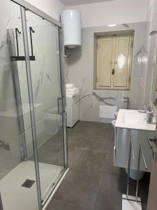 a bathroom with a shower and a sink at Sperlonga Apartment in Sperlonga