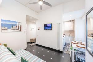 a kitchen and a living room with a refrigerator at NEW 2024 Hanging Garden in Corniglia