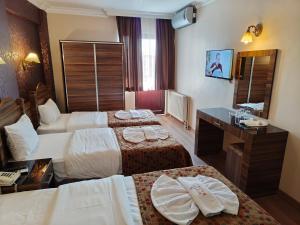 Postel nebo postele na pokoji v ubytování Hotel Bazaar + 37 fotografií
