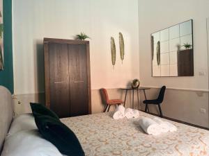 Кровать или кровати в номере Il Civico 2