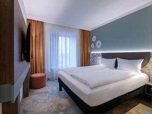 Postel nebo postele na pokoji v ubytování ibis Styles Kiel City