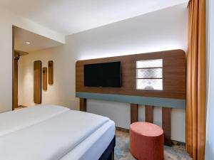 Postel nebo postele na pokoji v ubytování ibis Styles Kiel City