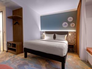 Postel nebo postele na pokoji v ubytování ibis Styles Kiel City