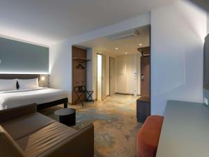 Postel nebo postele na pokoji v ubytování ibis Styles Kiel City