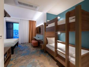 Postel nebo postele na pokoji v ubytování ibis Styles Kiel City