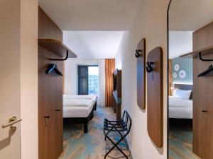 Postel nebo postele na pokoji v ubytování ibis Styles Kiel City